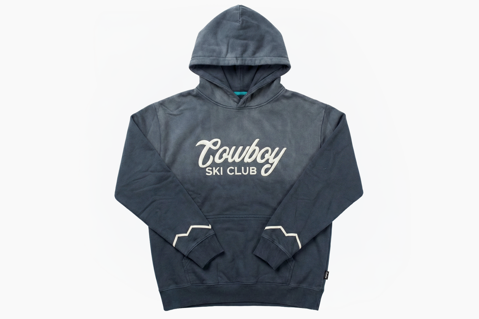 Midnight Blue — faded oversized hoodie with cream Cowboy Ski Club script and mountain cuff piping, front
